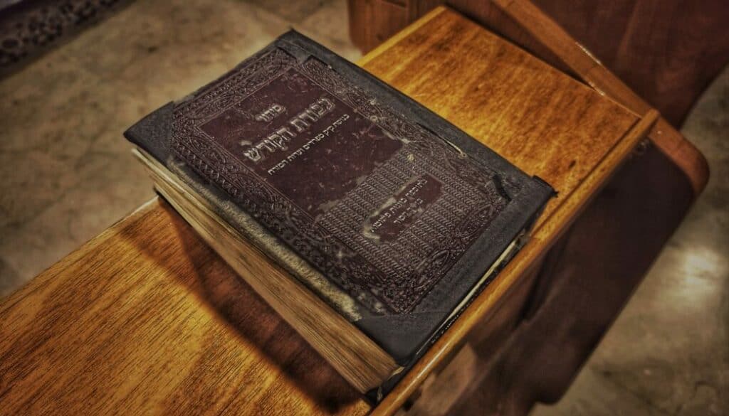 Brown hardbound book on brown wooden table