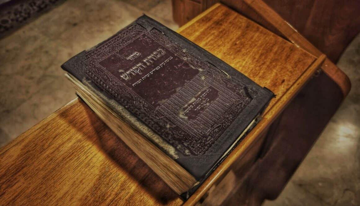 Brown hardbound book on brown wooden table